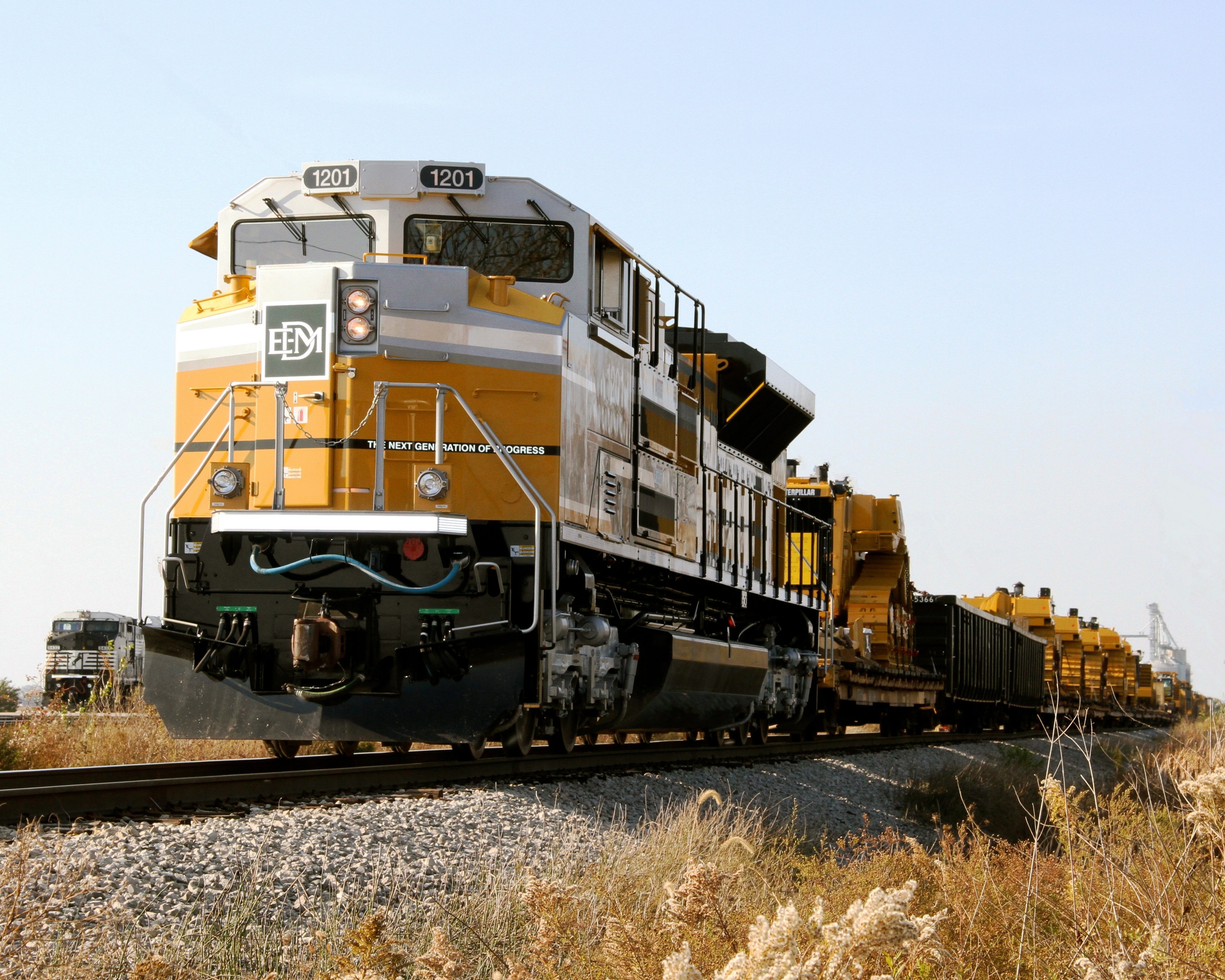 A train transporting various CAT equipment.