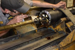 Cleveland Brothers employee inspecting machine part